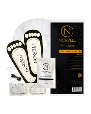 Norvell spray tan accessory kit with applicators and cream on a white background