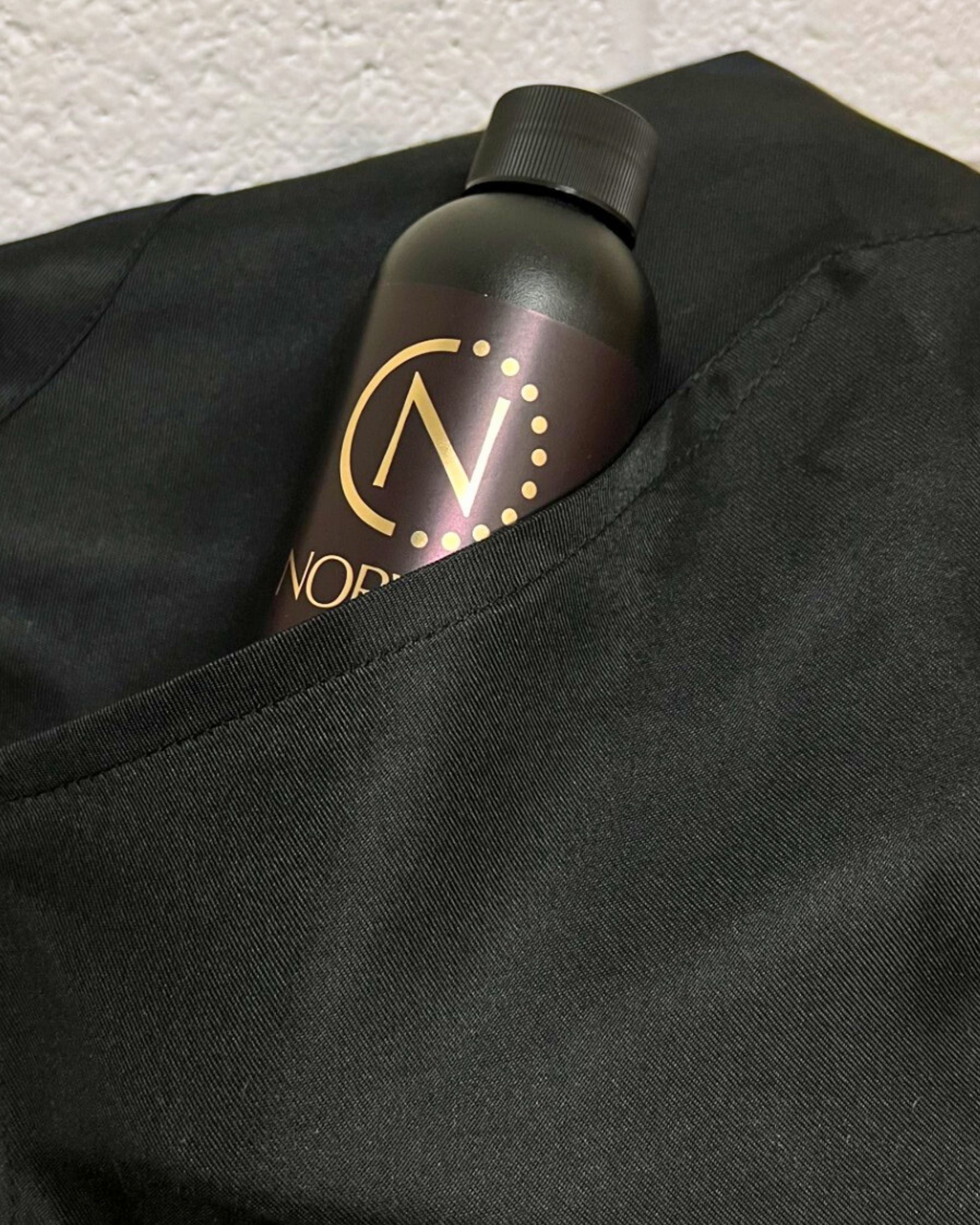 Norvell solution bottle in the Black apron pocket.