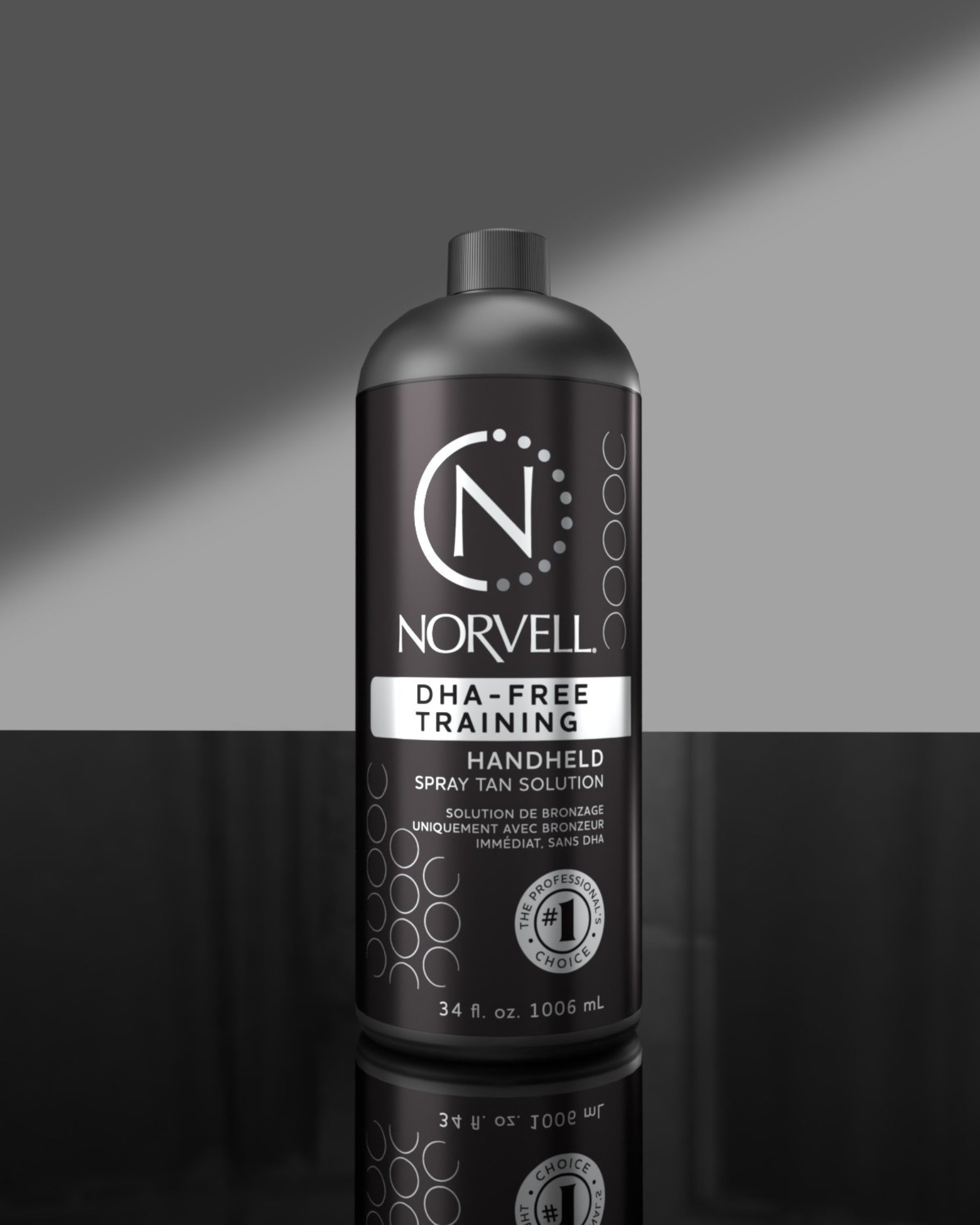Norvell handheld DHA Free spray tan solution bottle on a gray background