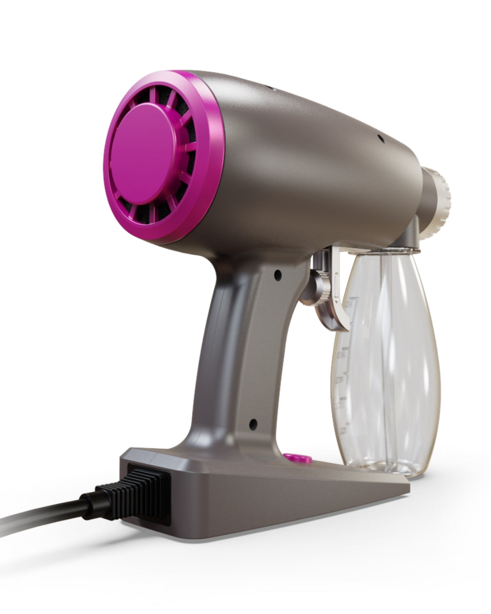 Right side view of Norvell Oasis Gray spray gun with pink accents on a white background
