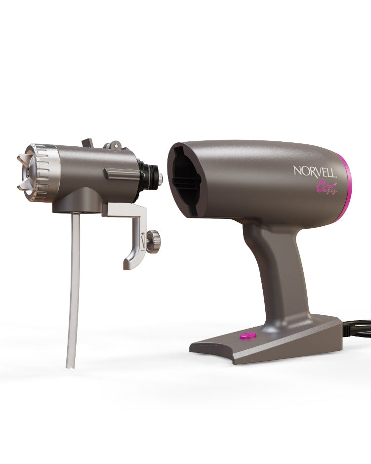 Norvell Oasis Gray spray gun with pink accents showing the spray head detached on a white background