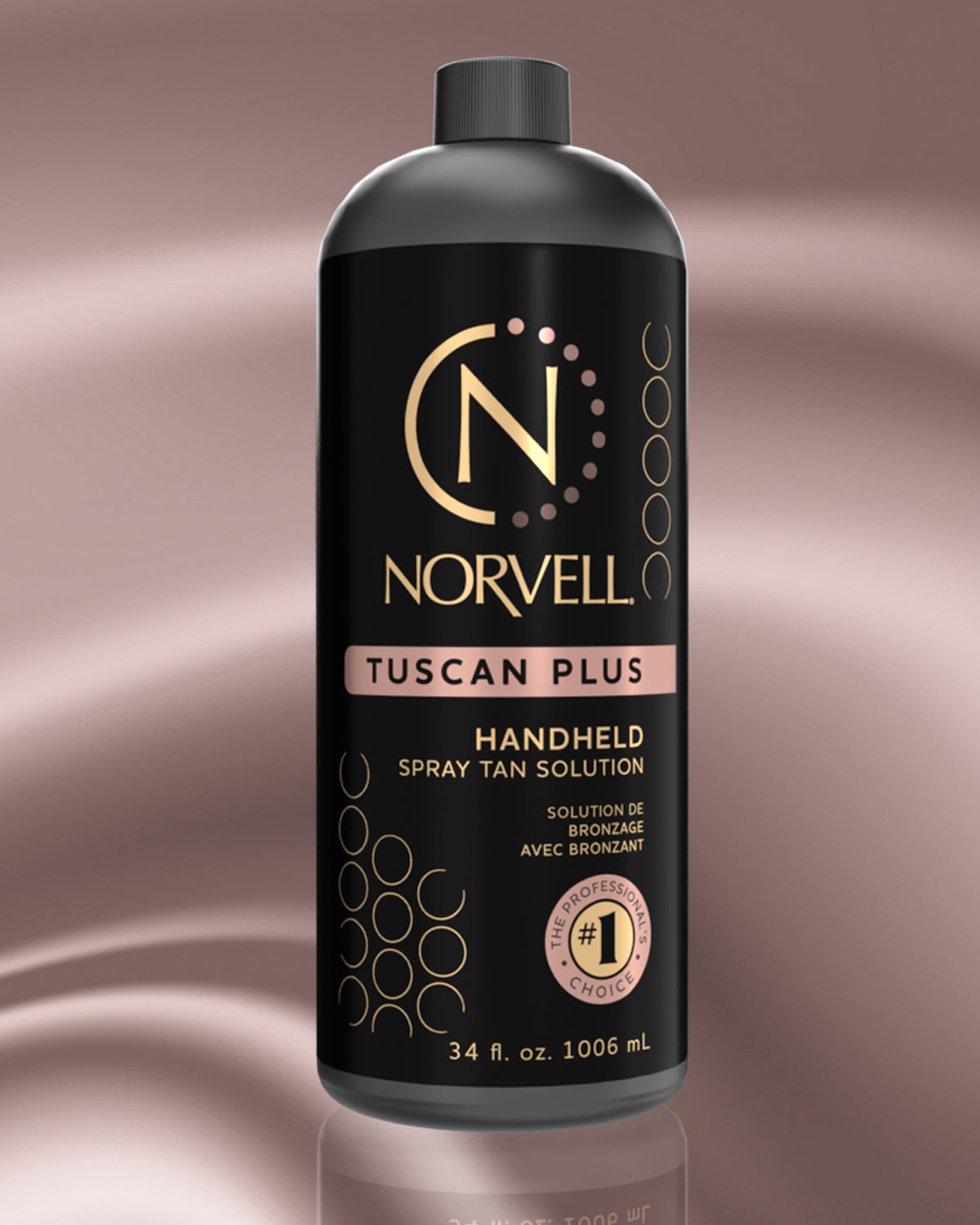 Norvell Tuscan Plus handheld spray tan solution bottle on a rose gold background