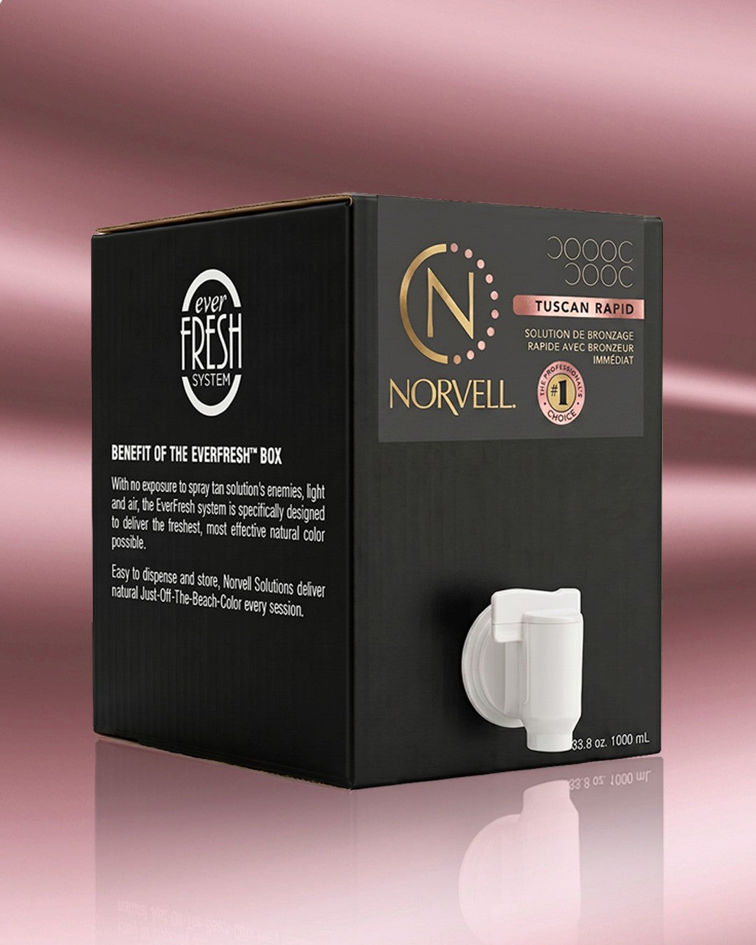 A black box of Norvell Tuscan Rapid Handheld Spray Tan Solution, featuring gold and pink accents, set against a pink gradient background with a soft reflection.