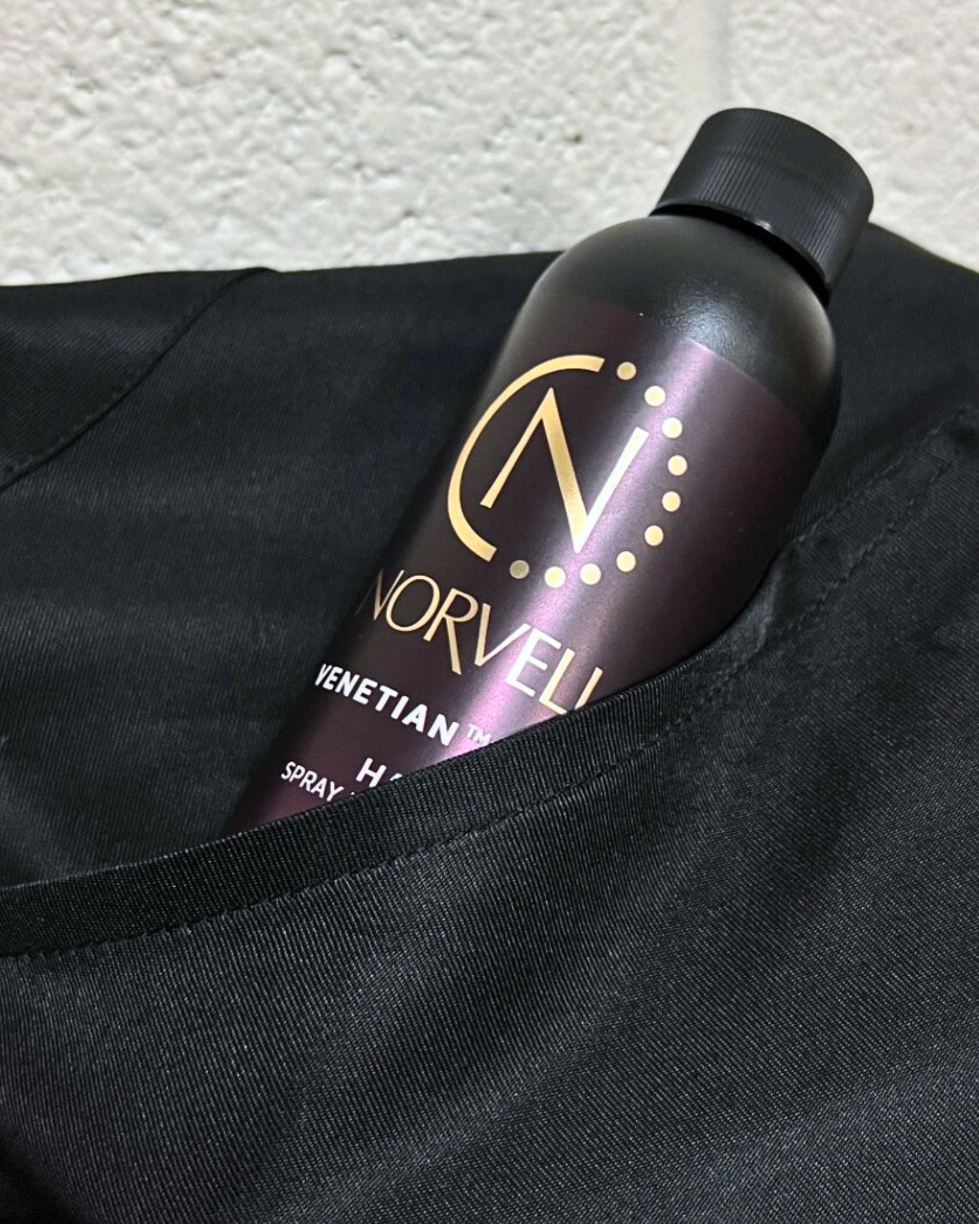 Norvell solution bottle in the Black apron pocket.