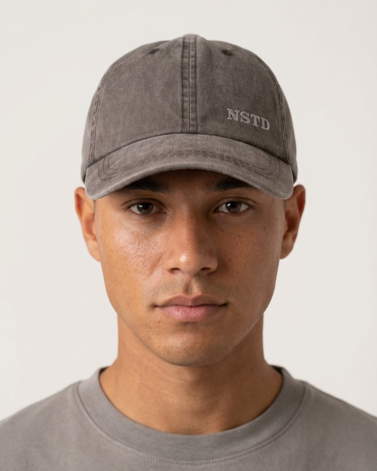 AI Render Person wearing a brown cap with 'NSTD' logo on a plain background